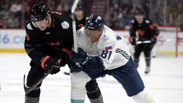 Sep 11, 2016; Montreal, Quebec, Canada; Team North America defenseman Colton Parayko (4) and Team Europe forward Marian Hossa (81) battle for the puck in the first period during a World Cup of Hockey pre-tournament game at the Bell Centre. Mandatory Credit: Eric Bolte-USA TODAY Sports