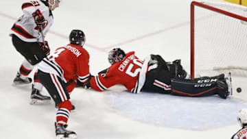 Nov 12, 2015; Chicago, IL, USA; New Jersey Devils center Sergey Kalinin (51) scores a game winning goal against Chicago Blackhawks goalie Corey Crawford (50) during the third period at United Center. Mandatory Credit: Kamil Krzaczynski-USA TODAY Sports