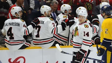 Jan 19, 2016; Nashville, TN, USA; Chicago Blackhawks right winger Richard Panik (14) is congratulated by teammates after a goal during the second period against the Nashville Predators at Bridgestone Arena. Mandatory Credit: Christopher Hanewinckel-USA TODAY Sports