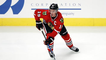 Oct 12, 2016; Chicago, IL, USA; Chicago Blackhawks center Jonathan Toews (19) looks to pass the puck against the St. Louis Blues during the third period at United Center. Mandatory Credit: Kamil Krzaczynski-USA TODAY Sports