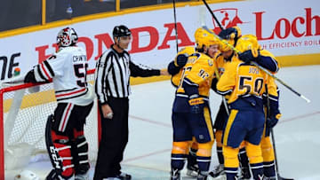 Oct 14, 2016; Nashville, TN, USA; Nashville Predators players celebrate after a goal by center Mike Fisher (12) past Chicago Blackhawks goalie Corey Crawford (50) in the second period at Bridgestone Arena. The Predators won 3-2. Mandatory Credit: Christopher Hanewinckel-USA TODAY Sports