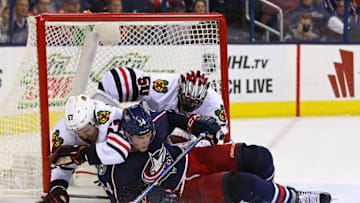 Oct 21, 2016; Columbus, OH, USA; Columbus Blue Jackets right wing Josh Anderson (34) collides with Chicago Blackhawks defenseman Trevor van Riemsdyk (57) and goalie Corey Crawford (50) in net in the second period at Nationwide Arena. Mandatory Credit: Aaron Doster-USA TODAY Sports