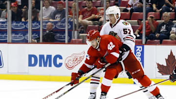 Sep 23, 2015; Detroit, MI, USA; Detroit Red Wings wing Martin Frk (42) skates with the puck defended by Chicago Blackhawks defenseman Trevor van Riemsdyk (57) in the third period at Joe Louis Arena. Detroit won 4-1. Mandatory Credit: Rick Osentoski-USA TODAY Sports
