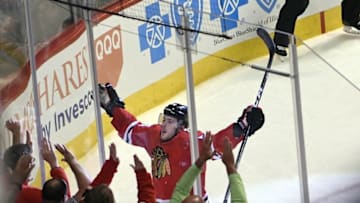 Nov 1, 2016; Chicago, IL, USA; Chicago Blackhawks left wing Tyler Motte (64) celebrates his goal against Calgary Flames during the third period at the United Center. The Hawks won 5-1. Mandatory Credit: David Banks-USA TODAY Sports