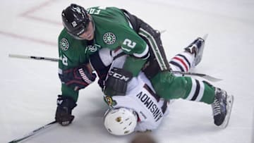 Nov 5, 2016; Dallas, TX, USA; Dallas Stars center Radek Faksa (12) takes down Chicago Blackhawks center Artem Anisimov (15) during the second period at the American Airlines Center. Mandatory Credit: Jerome Miron-USA TODAY Sports