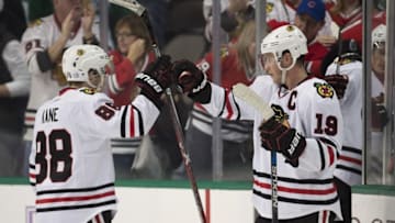 Nov 5, 2016; Dallas, TX, USA; Chicago Blackhawks center Jonathan Toews (19) and right wing Patrick Kane (88) celebrate the win over the Dallas Stars at the American Airlines Center. The Blackhawks defeat the Stars 3-2. Mandatory Credit: Jerome Miron-USA TODAY Sports