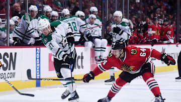 Nov 6, 2016; Chicago, IL, USA; Dallas Stars right wing Adam Cracknell (27) shoots the puck against Chicago Blackhawks left wing Tyler Motte (64) during the second period at United Center. Mandatory Credit: Mike DiNovo-USA TODAY Sports
