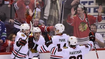 Nov 19, 2016; Vancouver, British Columbia, CAN; Chicago Blackhawks forward Vinnie Hinostroza (48) celebrates after scoring a goal against Vancouver Canucks goaltender Jacob Markstrom (not pictured) during the third period at Rogers Arena. The Chicago Blackhawks won 4-3 in overtime. Mandatory Credit: Anne-Marie Sorvin-USA TODAY Sports