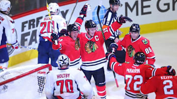 Nov 11, 2016; Chicago, IL, USA; Chicago Blackhawks right wing Marian Hossa (left) is congratulated for scoring a goal by center Jonathan Toews (center) and right wing Patrick Kane (right) during the third period against the Washington Capitals at the United Center. Washington won 3-2 in overtime. Mandatory Credit: Dennis Wierzbicki-USA TODAY Sports