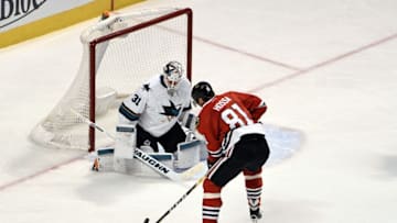 Dec 18, 2016; Chicago, IL, USA; Chicago Blackhawks right wing Marian Hossa (81) shoots on San Jose Sharks goalie Martin Jones (31) during the third period at the United Center. The Hawks won 4-1. Mandatory Credit: David Banks-USA TODAY Sports