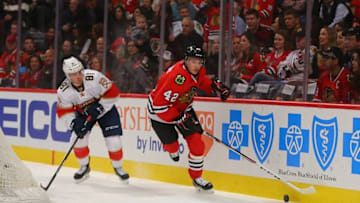 Nov 29, 2016; Chicago, IL, USA; Chicago Blackhawks defenseman Gustav Forsling (42) skates past Florida Panthers center Jonathan Marchessault (81) during the first period at the United Center. Mandatory Credit: Dennis Wierzbicki-USA TODAY Sports
