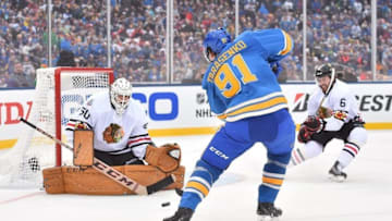 Jan 2, 2017; St. Louis, MO, USA; Chicago Blackhawks goalie Corey Crawford (50) makes a save on a shot by St. Louis Blues right wing Vladimir Tarasenko (91) during the second period in the 2016 Winter Classic ice hockey game at Busch Stadium. Mandatory Credit: Jasen Vinlove-USA TODAY Sports