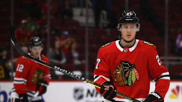 CHICAGO, IL - SEPTEMBER 25: Adam Boqvist #27 of the Chicago Blackhawks participates in warm-ups before a preseason game against the Detroit Red Wings at the United Center on September 25, 2018 in Chicago, Illinois. (Photo by Jonathan Daniel/Getty Images)