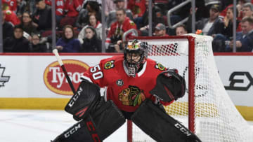 CHICAGO, IL - MARCH 18: Corey Crawford #50 of the Chicago Blackhawks defends the net against the Vancouver Canucks during the second period at the United Center on March 18, 2019 in Chicago, Illinois. (Photo by Bill Smith /NHLI via Getty Images)