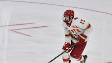 FARGO, NORTH DAKOTA - MARCH 29: Ian Mitchell #15 of the Denver Pioneers skates with the puck during his team's NCAA Division I Men's Ice Hockey West Regional Championship Semifinal game against the Ohio State Buckeyes at Scheels Arena on March 29, 2019 in Fargo, North Dakota. (Photo by Sam Wasson/Getty Images)