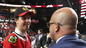 VANCOUVER, BRITISH COLUMBIA - JUNE 22: Michal Teply, 105th overall pick of the Chicago Blackhawks, is greeted by team personnel at the team draft table during Rounds 2-7 of the 2019 NHL Draft at Rogers Arena on June 22, 2019 in Vancouver, Canada. (Photo by Dave Sandford/NHLI via Getty Images)
