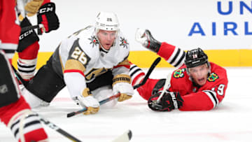 CHICAGO, IL - OCTOBER 22: Paul Stastny #26 of the Vegas Golden Knights and Jonathan Toews #19 of the Chicago Blackhawks get physical in the second period at the United Center on October 22, 2019 in Chicago, Illinois. (Photo by Chase Agnello-Dean/NHLI via Getty Images)