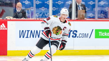WINNIPEG, MB - FEBRUARY 9: Jonathan Toews #19 of the Chicago Blackhawks takes part in the pre-game warm up prior to NHL action against the Winnipeg Jets at the Bell MTS Place on February 9, 2020 in Winnipeg, Manitoba, Canada. (Photo by Darcy Finley/NHLI via Getty Images)