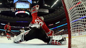 CHICAGO, IL - JUNE 12: Goalie Corey Crawford #50 of the Chicago Blackhawks makes a save in the first period against the Boston Bruins in Game One of the 2013 NHL Stanley Cup Final at United Center on June 12, 2013 in Chicago, Illinois. (Photo by BB/Getty Images)