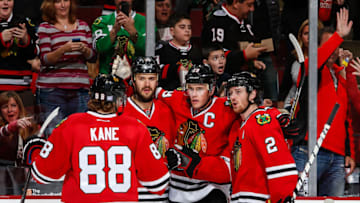 CHICAGO, IL - OCTOBER 26: Jonathan Toews #19 of the Chicago Blackhawks celebrates with teammates Patrick Kane #88, Brent Seabrook #7, and Duncan Keith #2 after scoring against the Ottawa Senators in the second period during the NHL game on October 26, 2014 at the United Center in Chicago, Illinois. (Photo by Bill Smith/NHLI via Getty Images)