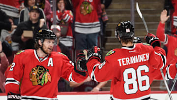 CHICAGO, IL - DECEMBER 08: Duncan Keith #2 of the Chicago Blackhawks celebrates with Teuvo Teravainen #86 after Teravainen scored against the Nashville Predators in the third period of the NHL game at the United Center on December 8, 2015 in Chicago, Illinois. (Photo by Bill Smith/NHLI via Getty Images)
