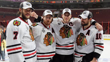 PHILADELPHIA - JUNE 09: (L-R) Brent Seabrook #7, Duncan Keith #2, Jonathan Toews #19 and Patrick Sharp #10 of the Chicago Blackhawks celebrate after the Blackhawks defeated the Philadelphia Flyers 4-3 in overtime to win the Stanley Cup in Game Six of the 2010 NHL Stanley Cup Final at the Wachovia Center on June 9, 2010 in Philadelphia, Pennsylvania. (Photo by Jim McIsaac/Getty Images)