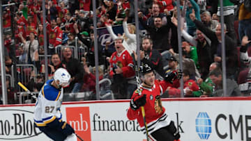 CHICAGO, IL - OCTOBER 13: Alex DeBrincat #12 of the Chicago Blackhawks celebrates his goal against the St. Louis Blues during the third period at the United Center on October 13, 2018 in Chicago, Illinois. (Photo by Bill Smith/NHLI via Getty Images)
