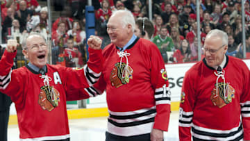 CHICAGO, IL - JANUARY 09: Former Chicago Blackhawks players Pierre Pilote, Ab McDonald, and Wayne Hicks of the 1961 Stanley Cup Championship team are honored before the game against the New York Islanders on January 9, 2011 at the United Center in Chicago, Illinois. (Photo by Bill Smith/NHLI via Getty Images)