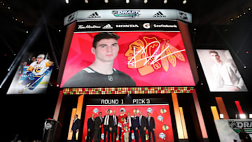 VANCOUVER, BRITISH COLUMBIA - JUNE 21: Kirby Dach reacts after being selected third overall by the Chicago Blackhawks during the first round of the 2019 NHL Draft at Rogers Arena on June 21, 2019 in Vancouver, Canada. (Photo by Bruce Bennett/Getty Images)
