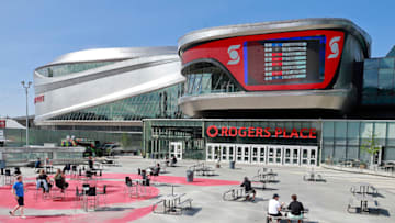 EDMONTON, ALBERTA - AUGUST 10: Players and staff watch the second phase of the NHL draft lottery as they sit in the recreation area outside Rogers Place on August 10, 2020 during the 2020 NHL Stanley Cup Playoffs in Edmonton, Alberta, Canada. The New York Rangers won the first pick. (Photo by Jeff Vinnick/Getty Images)