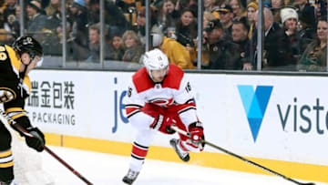 BOSTON, MA - JANUARY 06: Carolina Hurricanes center Marcus Kruger (16) plays the puck during a game between the Boston Bruins and the Carolina Hurricanes on January 6, 2018, at TD Garden in Boston, Massachusetts. The Bruins defeated the Hurricanes 7-1. (Photo by Fred Kfoury III/Icon Sportswire via Getty Images)