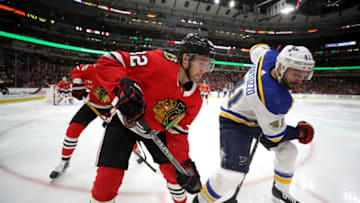 CHICAGO, IL - APRIL 06: Robert Bortuzzo #41 of the St. Louis Blues and Jordan Oesterle #82 of the Chicago Blackhawks watch for the puck in the third period at the United Center on April 6, 2018 in Chicago, Illinois. (Photo by Chase Agnello-Dean/NHLI via Getty Images)