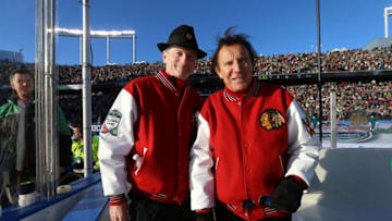 MINNEAPOLIS, MN - FEBRUARY 20: Head Coaches Pat Foley (L) and Tony Esposito of the Chicago Blackhawks Alumni look on from the bench area prior to the 2016 Coors Light Stadium Series Alumni Game at TCF Bank Stadium on February 20, 2016 in Minneapolis, Minnesota. (Photo by Dave Sandford/NHLI via Getty Images)