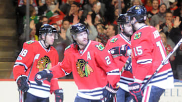 CHICAGO, IL - JANUARY 26: Chicago Blackhawks Defenceman Duncan Keith (2) is congratulated by teammates Chicago Blackhawks Right Wing Patrick Kane (88), Chicago Blackhawks Defenceman Brent Seabrook (7) and Chicago Blackhawks Center Artem Anisimov (15) after a first period goal on January 26, 2017, at the United Center in Chicago, Illinois. (Photo by Kathleen Hinkel/Icon Sportswire via Getty Images)