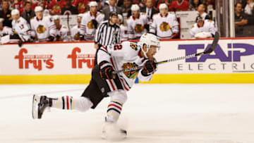 GLENDALE, AZ - OCTOBER 21: Chicago Blackhawks defenseman Jordan Oesterle (82) follows through on a shot during the NHL hockey game between the Chicago Blackhawks and the Arizona Coyotes on October 21, 2017 at Gila River Arena in Glendale, Arizona. (Photo by Kevin Abele/Icon Sportswire via Getty Images)