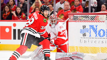 CHICAGO, IL - JANUARY 14: Chicago Blackhawks left wing Ryan Hartman (38) looks to make a play on Detroit Red Wings goaltender Petr Mrazek (34) during the game between the Chicago Blackhawks and the Detroit Red Wings on January 14, 2018 at the United Center in Chicago, Illinois. (Photo by Quinn Harris/Icon Sportswire via Getty Images)
