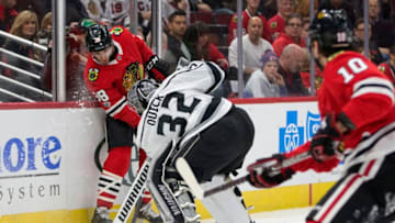Chicago Blackhawks right wing Patrick Kane (88) and Los Angeles Kings goalie Jonathan Quick (32) fight for control of the puck behind the net during the first period on Sunday, Dec. 3, 2017, at the United Center in Chicago, Ill. (Erin Hooley/Chicago Tribune/TNS via Getty Images)