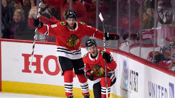 CHICAGO, IL - MARCH 18: Chicago Blackhawks right wing Alex DeBrincat (12) celebrates with Chicago Blackhawks center Nick Schmaltz (8) and teammates after scoring a goal in the first period of play during a game between the Chicago Blackhawks and the St. Louis Blues on March 18, 2018, at the United Center in Chicago, Illinois. (Photo by Robin Alam/Icon Sportswire via Getty Images)