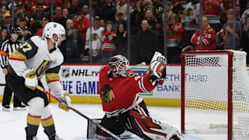 CHICAGO, ILLINOIS - OCTOBER 22: Shea Theodore #27 of the Vegas Golden Knights scores the game winning goal against Robin Lehner #40 of the Chicago Blackhawks during a shootout at the United Center on October 22, 2019 in Chicago, Illinois. (Photo by Stacy Revere/Getty Images)