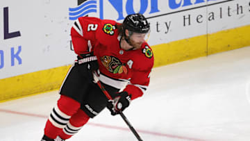 CHICAGO, ILLINOIS - MARCH 07: Duncan Keith #2 of the Chicago Blackhawks controls the puck against the Tampa Bay Lightning at the United Center on March 07, 2021 in Chicago, Illinois. The Lightning defeated the Blackhawks 6-3. (Photo by Jonathan Daniel/Getty Images)