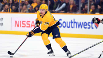 Feb 25, 2020; Nashville, Tennessee, USA; Nashville Predators center Mikael Granlund (64) skates with the puck during the first period against the Ottawa Senators at Bridgestone Arena. Mandatory Credit: Christopher Hanewinckel-USA TODAY Sports