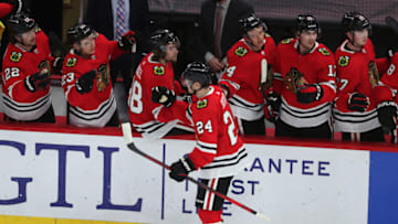 Mar 27, 2021; Chicago, Illinois, USA; Chicago Blackhawks center Pius Suter (24) is congratulated for scoring a goal during the second period against the Nashville Predators at the United Center. Mandatory Credit: Dennis Wierzbicki-USA TODAY Sports