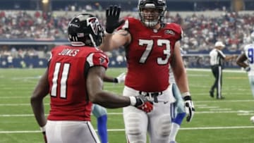 Sep 27, 2015; Arlington, TX, USA; Atlanta Falcons tackle Ryan Schraeder (73) celebrates with receiver Julio Jones (11) after a touchdown in the fourth quarter against the Dallas Cowboys at AT&T Stadium. Mandatory Credit: Matthew Emmons-USA TODAY Sports