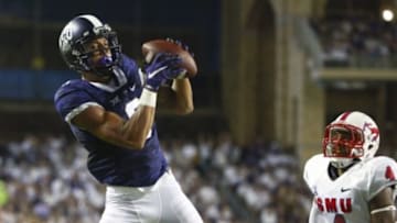 Sep 19, 2015; Fort Worth, TX, USA; TCU Horned Frogs wide receiver Josh Doctson (9) catches a touchdown pass past Southern Methodist Mustangs defensive back David Johnson (4) during the first half at Amon G. Carter Stadium. Mandatory Credit: Kevin Jairaj-USA TODAY Sports