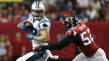 Dec 27, 2015; Atlanta, GA, USA; Carolina Panthers tight end Greg Olsen (88) carries the ball after a catch past Atlanta Falcons outside linebacker Justin Durant (52) in the second quarter at the Georgia Dome. Mandatory Credit: Jason Getz-USA TODAY Sports