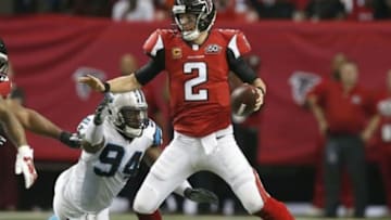 Dec 27, 2015; Atlanta, GA, USA; Atlanta Falcons quarterback Matt Ryan (2) escapes the pressure by Carolina Panthers defensive end Kony Ealy (94) in the fourth quarter at the Georgia Dome. Mandatory Credit: Jason Getz-USA TODAY Sports