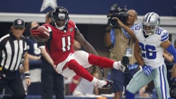 Sep 27, 2015; Arlington, TX, USA; Atlanta Falcons receiver Julio Jones (11) dives for the pylon to score a touchdown in the third quarter against Dallas Cowboys cornerback Tyler Patmon (26) at AT&T Stadium. Mandatory Credit: Matthew Emmons-USA TODAY Sports