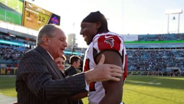 Dec 20, 2015; Jacksonville, FL, USA; Atlanta Falcons wide receiver Roddy White (84) hugs owner Arthur Blank as they beat the Jacksonville Jaguars during the second half at EverBank Field. Atlanta Falcons defeated the Jacksonville Jaguars 23-17. Mandatory Credit: Kim Klement-USA TODAY Sports