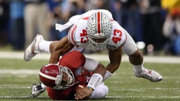 Jan 1, 2015; New Orleans, LA, USA; Alabama Crimson Tide quarterback Blake Sims (6) is sacked by Ohio State Buckeyes linebacker Darron Lee (43) in the third quarter of the 2015 Sugar Bowl at Mercedes-Benz Superdome. Mandatory Credit: Chuck Cook-USA TODAY Sports