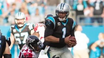 Dec 13, 2015; Charlotte, NC, USA; Carolina Panthers quarterback Cam Newton (1) is sacked by Atlanta Falcons defensive end Vic Beasley (44) during the third quarter at Bank of America Stadium. Panthers defeated the Falcons 38-0. Mandatory Credit: Jeremy Brevard-USA TODAY Sports